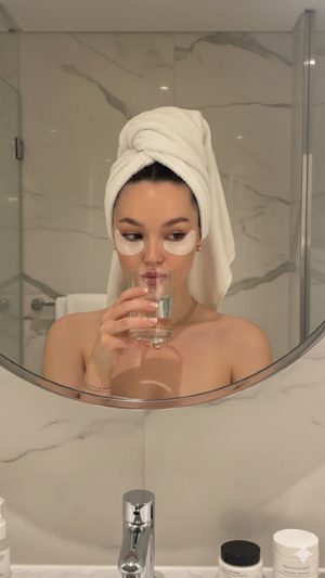 Josie in a towel wrap with eye patches